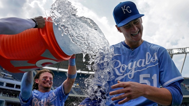 Singer throws eight innings of three-hit ball as Royals pound Mets to complete sweep